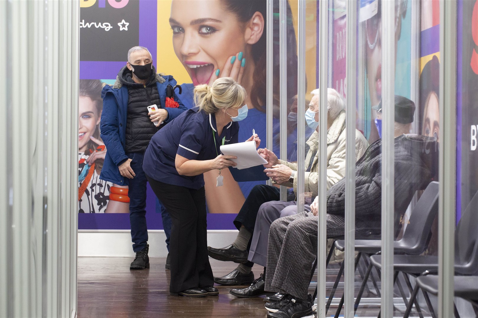 Social distancing measures put in place at Superdrug in Guildford as patients wait for the vaccine (Matt Alexander/PA)