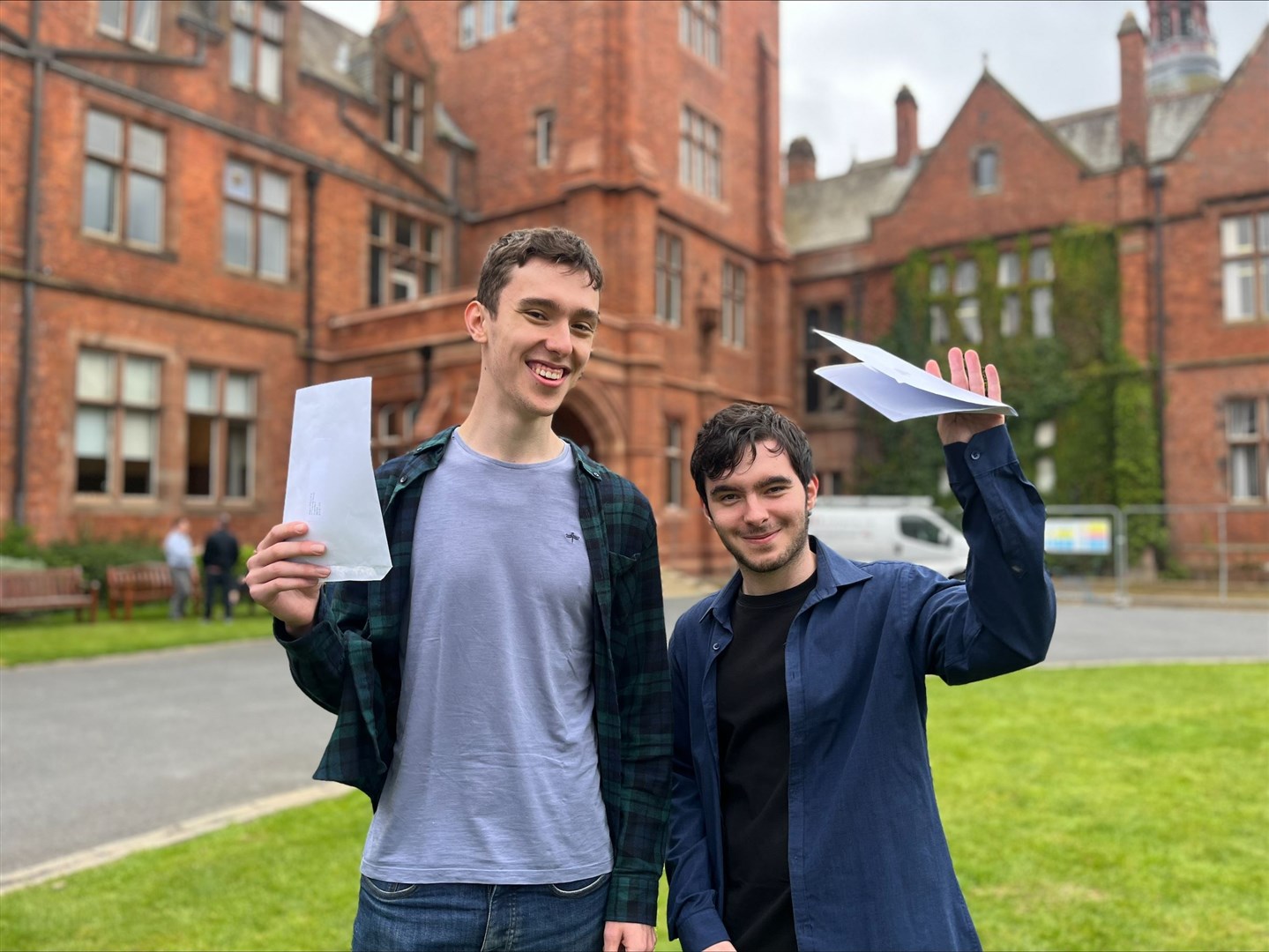 Twin brother Angus and Aaron Pollock from Campbell College, Belfast on A-Level results day (Claudia Savage/PA)