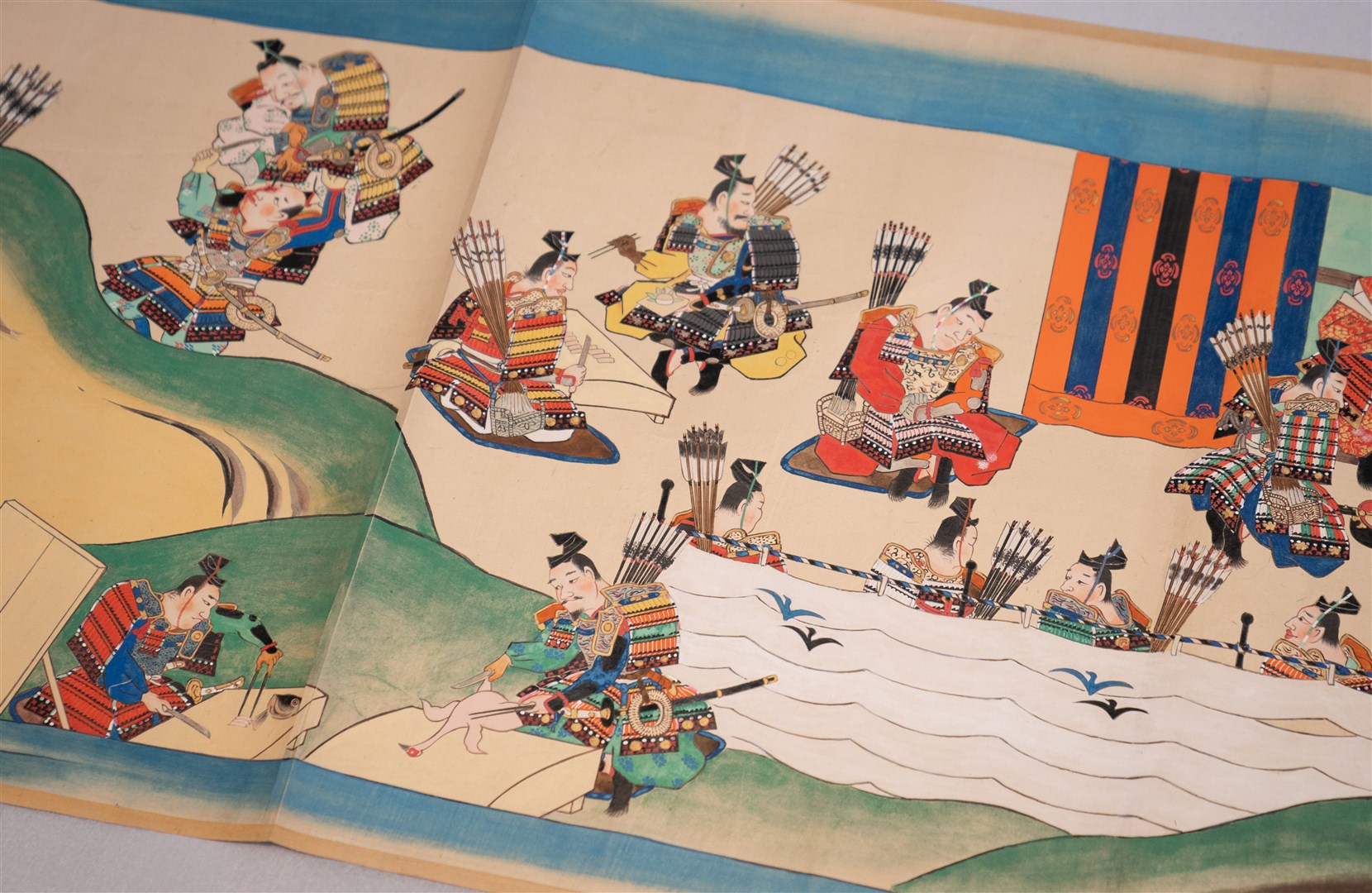 Detail on one of three Japanese scrolls, showing samurai preparing food before a battle (Joe Giddens/PA)