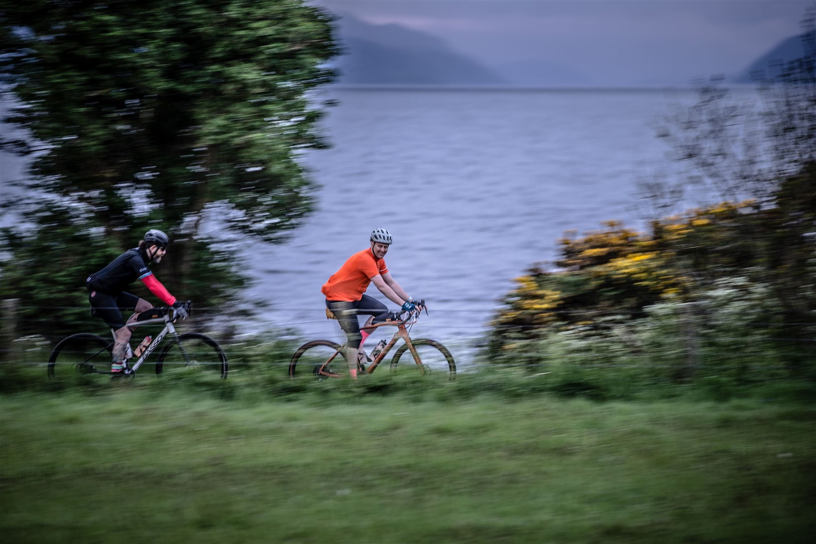 Cyclists enjoy the scenery around Loch Ness.