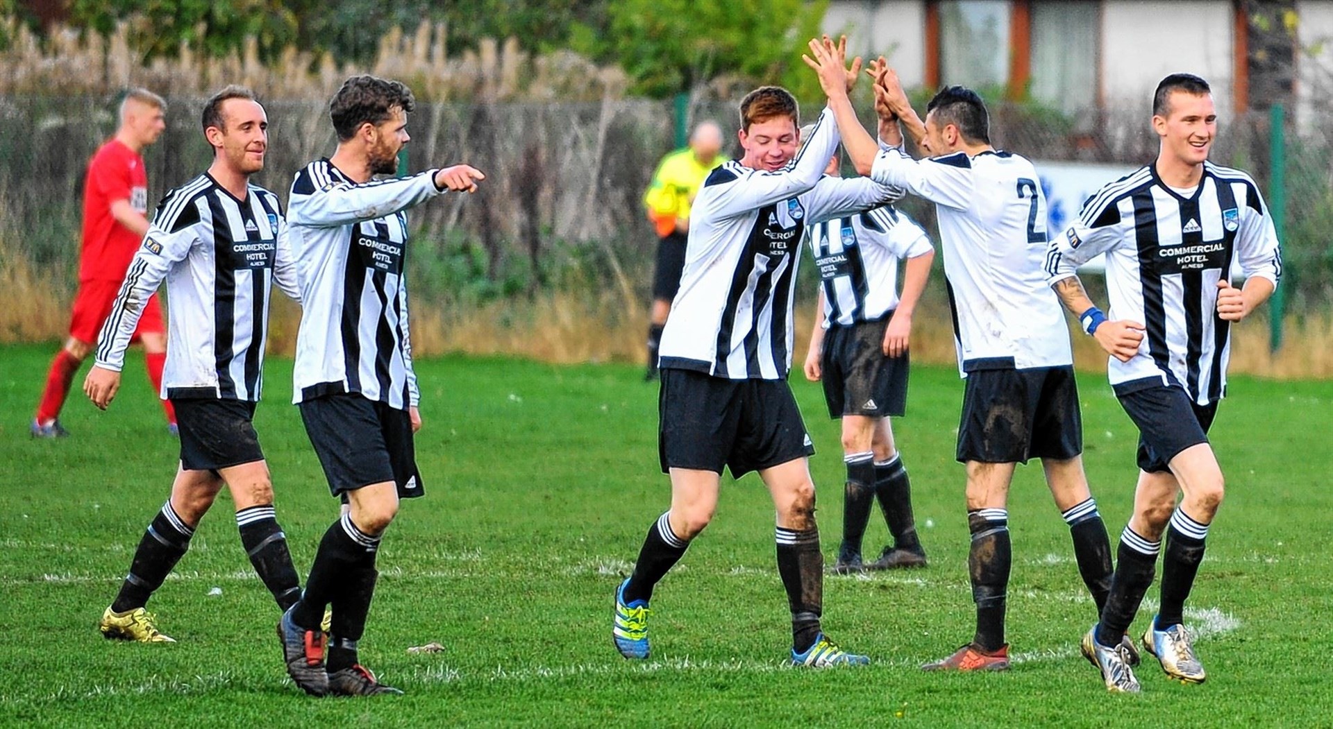 Alness United players celebrate Jack Mackay's opener. Picture: Graeme Webster