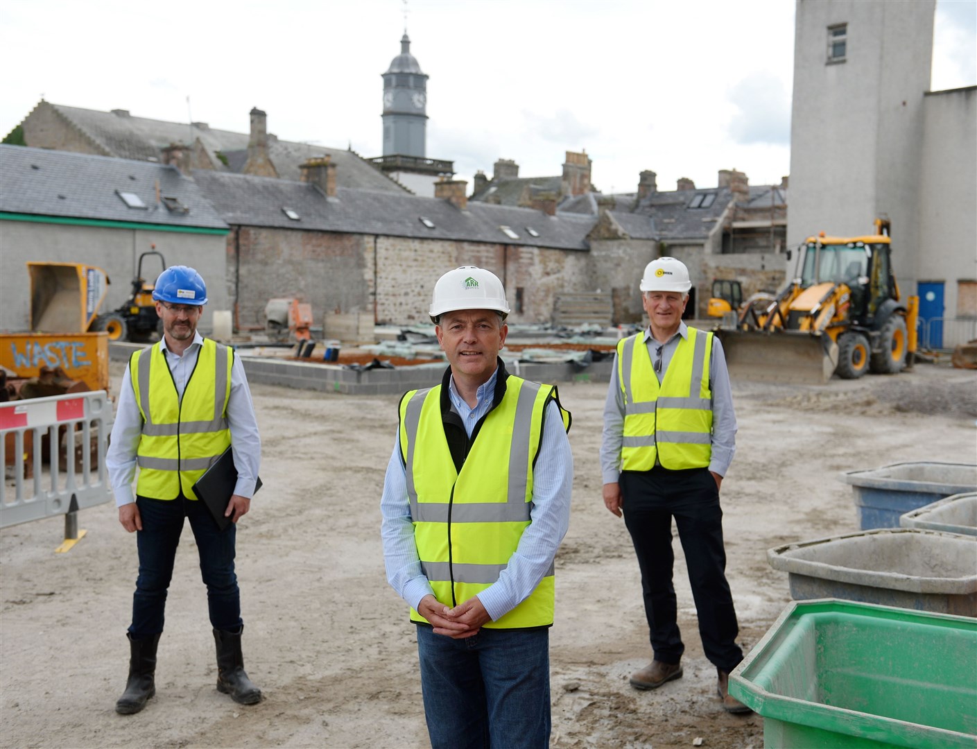 A flats and retail development in the heart of Dingwall is getting back under way. Iain Martin of Martin Associates (left) with Willie Gray of Ark Estates and James Manson of O'Brien. Picture: Gary Anthony