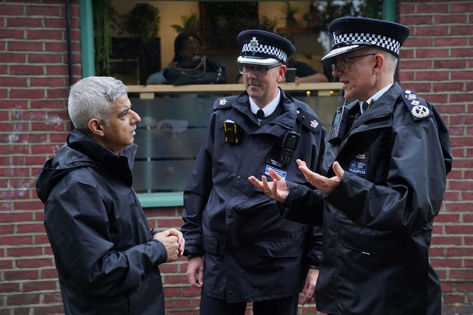 Sadiq Khan speaks to Superintendent Sean Lynch, and Metropolitan Police Commissioner Sir Mark Rowley at the launch of a mobile phone robbery intervention initiative (Jonathan Brady/PA)