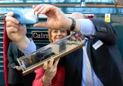 Nicola Sturgeon poses for Serco CEO Rupert Soames who wanted a souviner selfie with her at the Caledonian Sleeper train unveiling.