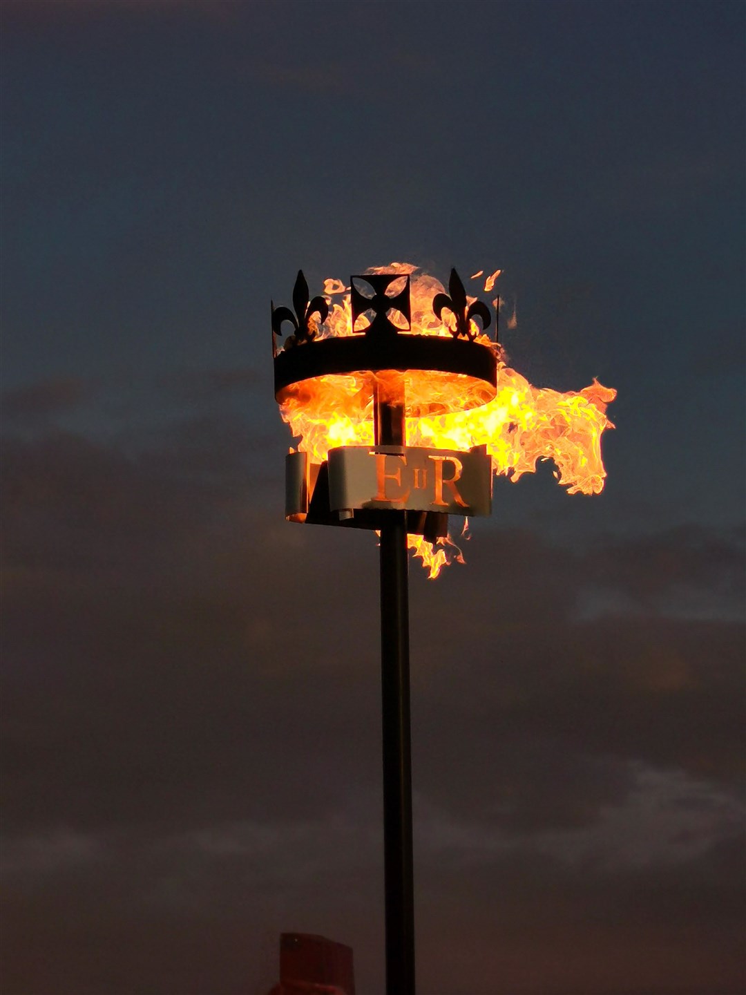 The Platinum Jubilee Beacon at Chanonry Point which was lit by dolphin conservationist Charlie Phillips watched by local cubs, scouts and residents on Thursday, June 2. Picture: Susan Phillips