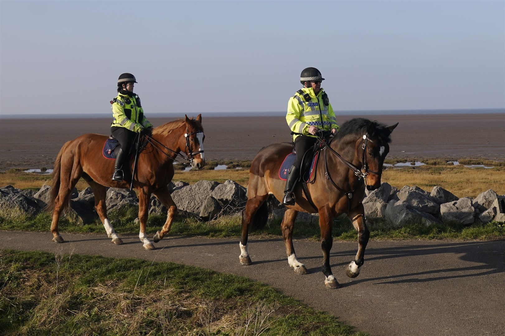 Mounted police in Knott End-on-Sea take part in the search (Danny Lawson/PA)