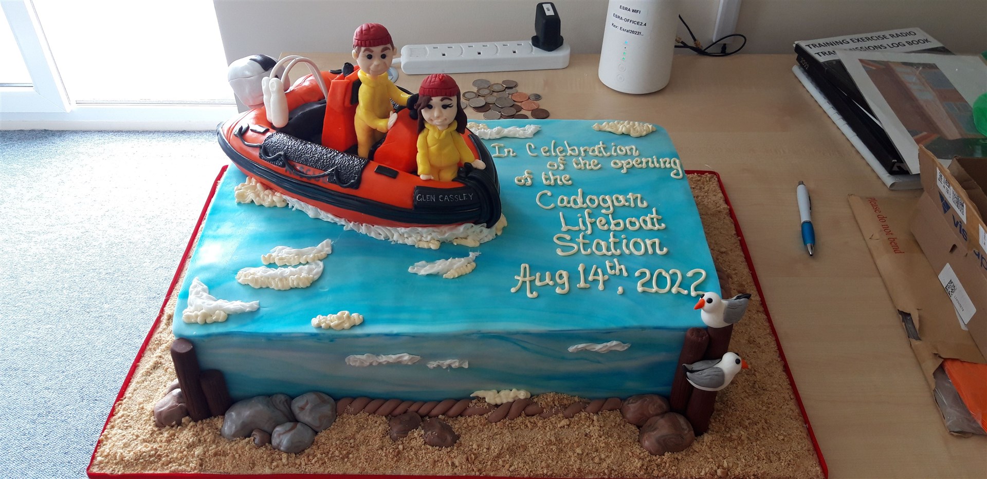 A stunning cake topped with an edible boat and crew members was made to mark the opening of The Cadogan Lifeboat Station.