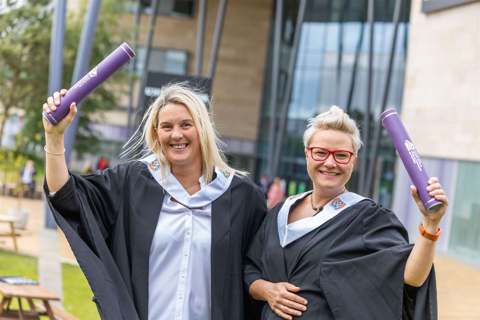HND Sports Therapy graduates Jo Abernethy and Lidia Kuzma from Inverness celebrate together.