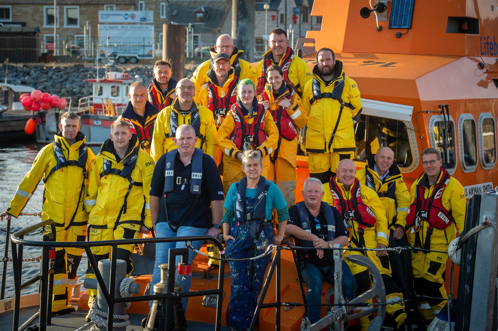 Artist Tracey Slough (centre) with the Invergordon RNLI lifeboat crew. Picture: Callum Mackay.