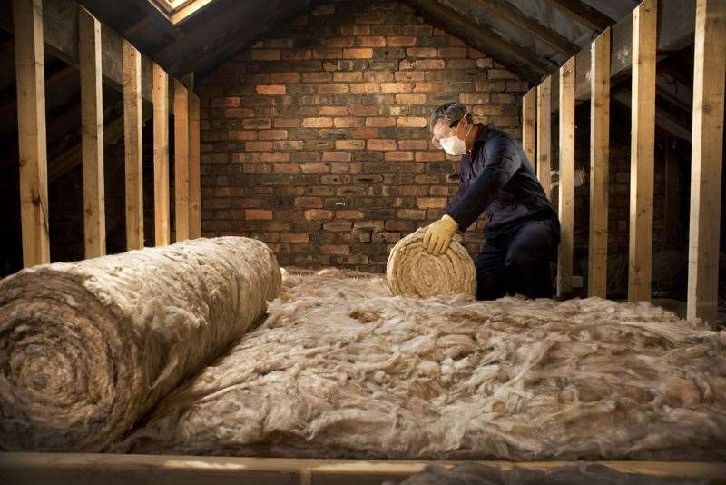 Installing loft insulation. A cost effective thickness for loft insulation is 27cm. Adding more will improve insulation but the payback time for the investment will be longer.