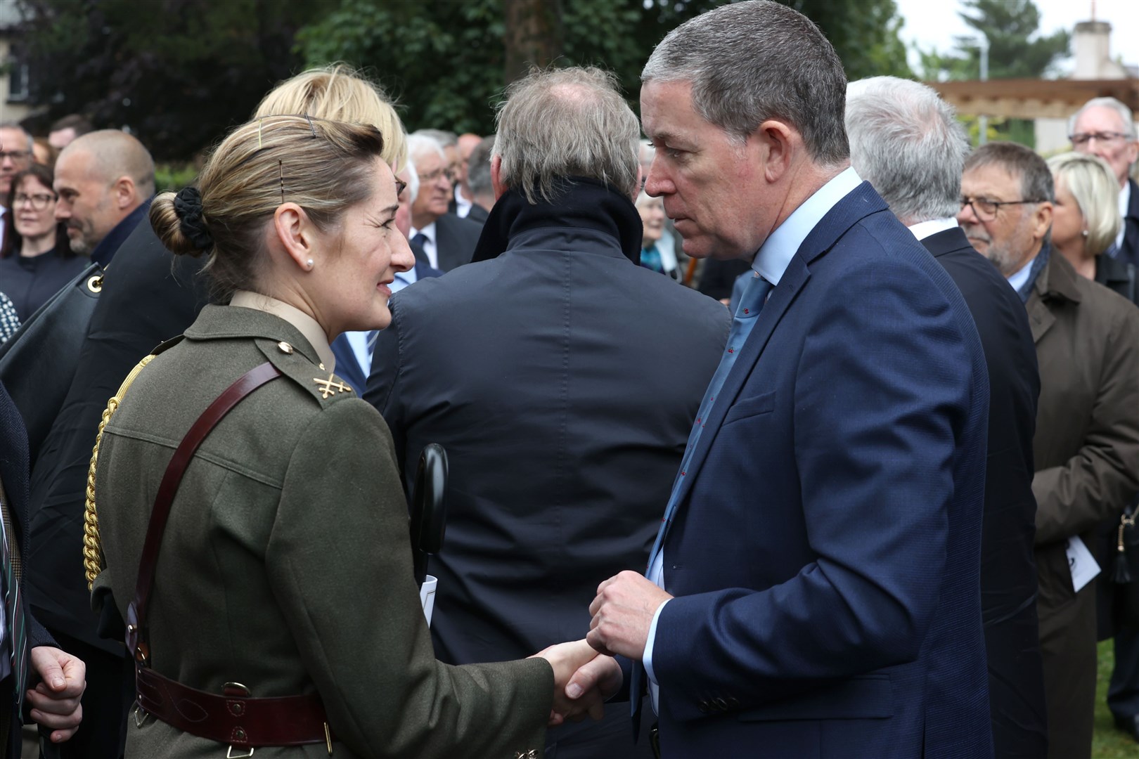 Commandant Claire Mortimer (left) Aide De Camp representing the Taoiseach talking to Jim Fitzpatrick’s son Dominic at his funeral (Liam McBurney/PA)