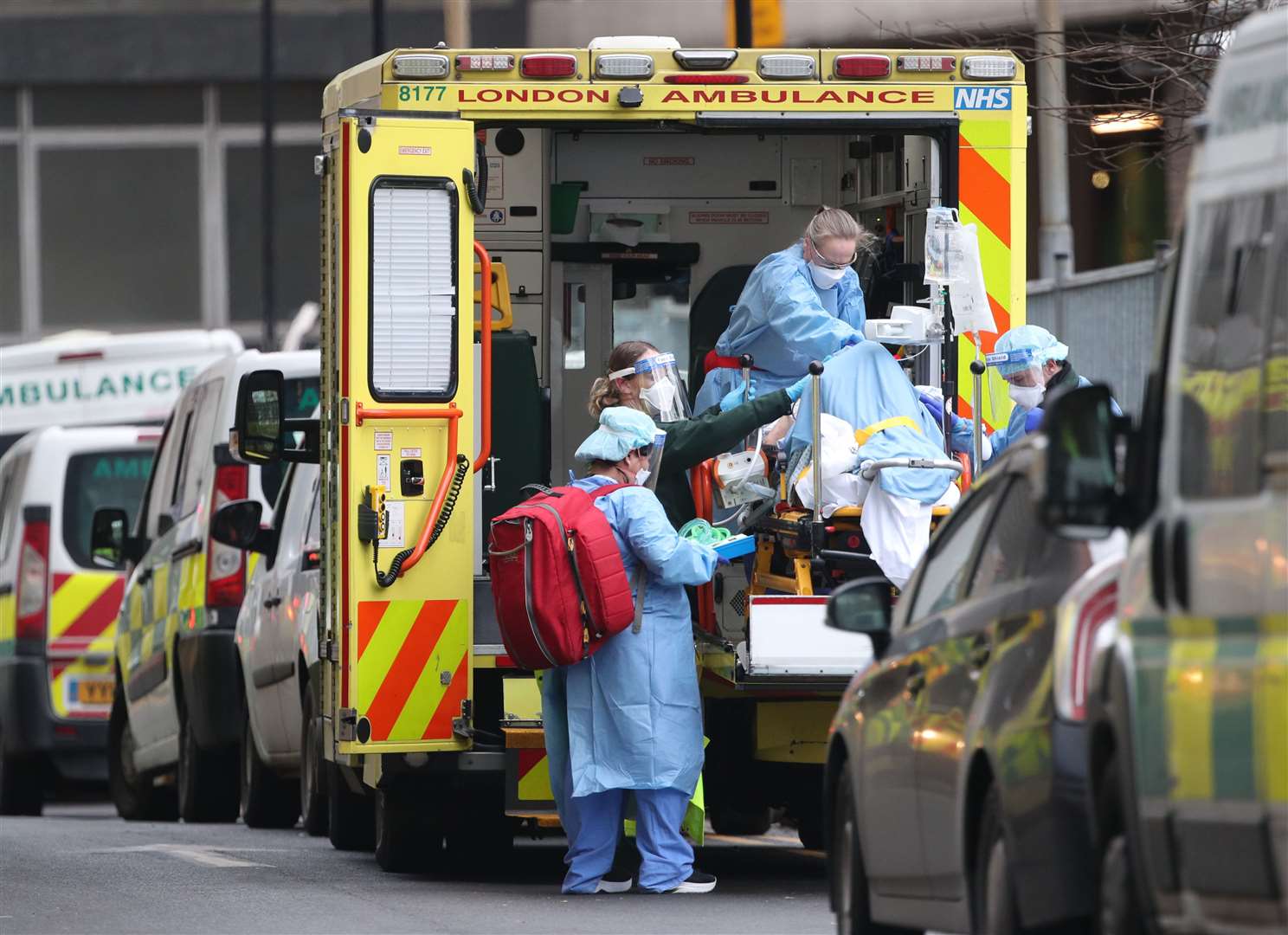 Paramedics and hospital staff attend to a patient outside the Royal London Hospital (Yui Mok/PA)