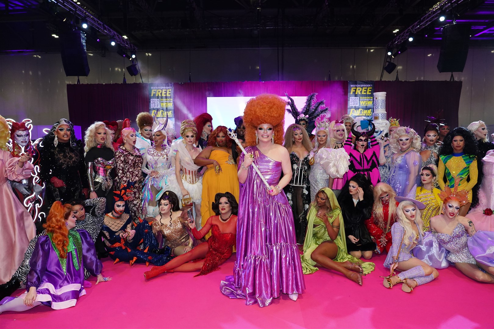 Ginger Johnson (centre) surrounded by drag queens from franchises across the globe (Ian West/PA)