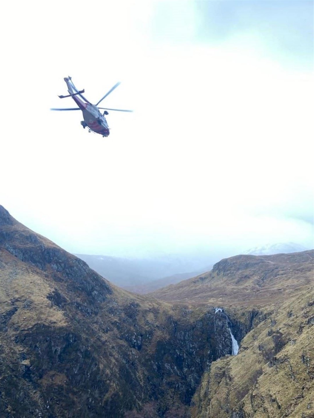 The Coastguard's rescue helicopter at the Falls of Glomach during Wednesday's rescue. Picture: Kintail MRT.