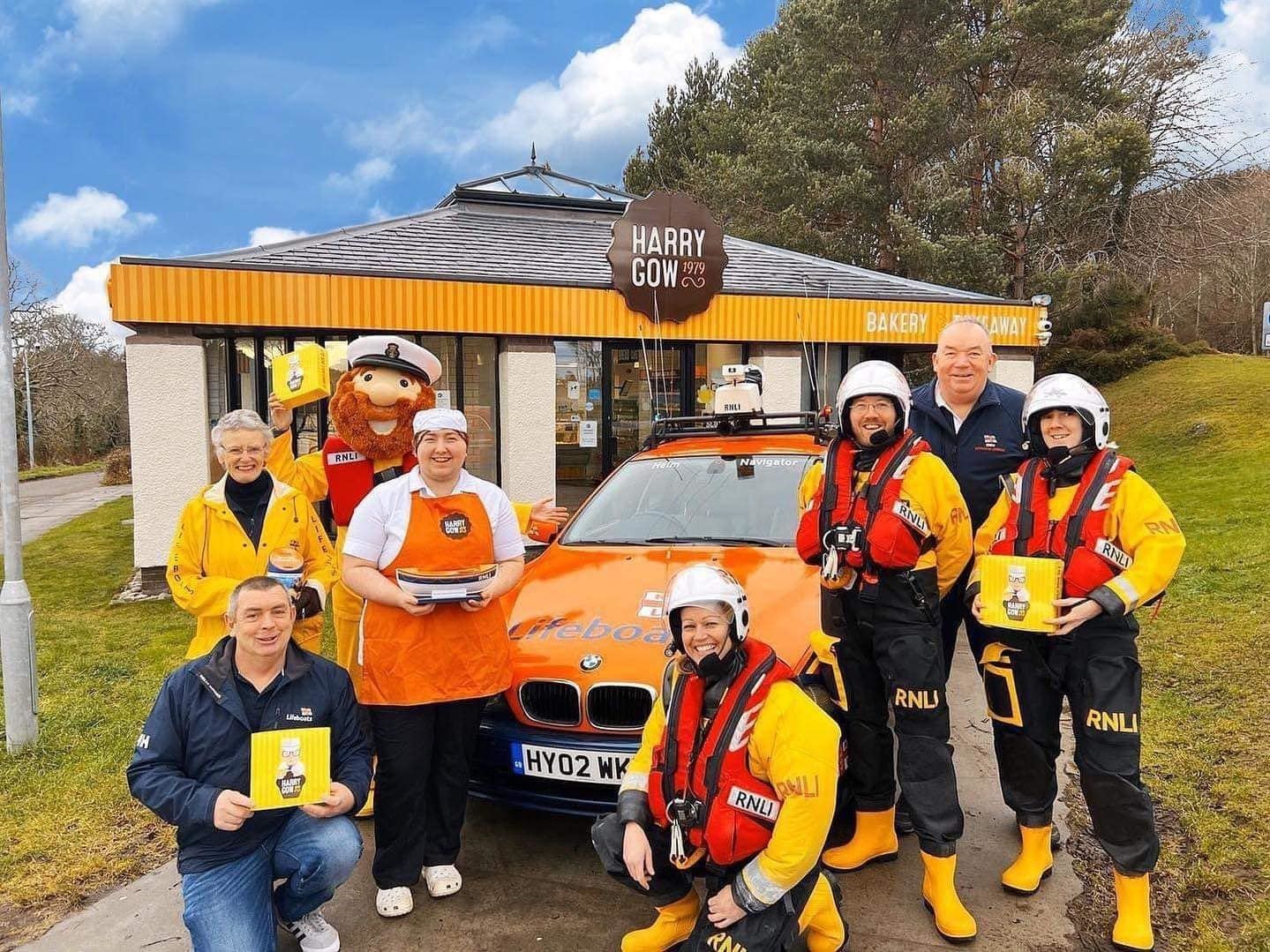 RNLI crew members and Harry Gow staff outside the bakery's North Kessock store. Picture: RNLI Kessock.