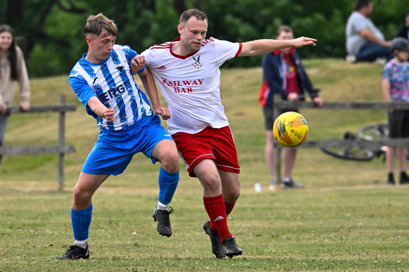 Alex Mackenzie (Inver) and Stefan MacRitchie (Tain Thistle) compete for the ball. Picture: Scott Macdonald