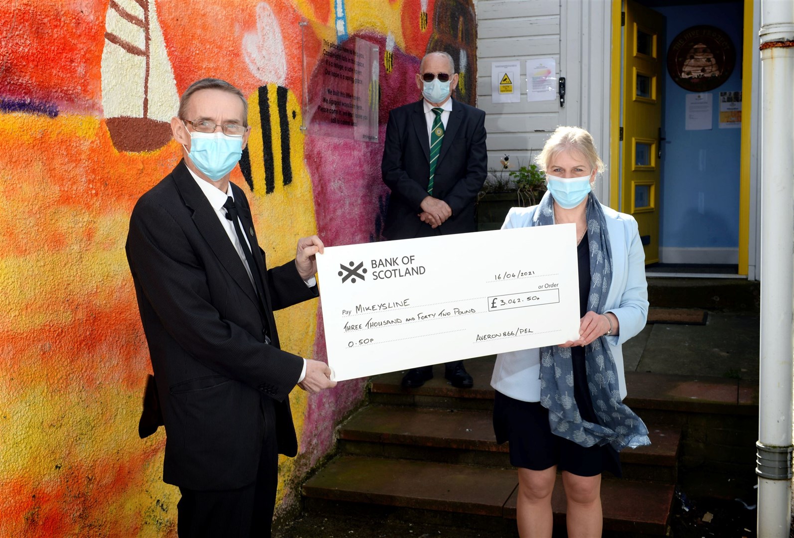 George Robinson raised £3042 from the sale of his tapestry. George Robinson, Lodge Averon and Robin Cattanach, Provincial Grandmaster of Ross & Cromarty, present the cheque to Emily Stokes, service manager of Mikeysline. Picture: James Mackenzie