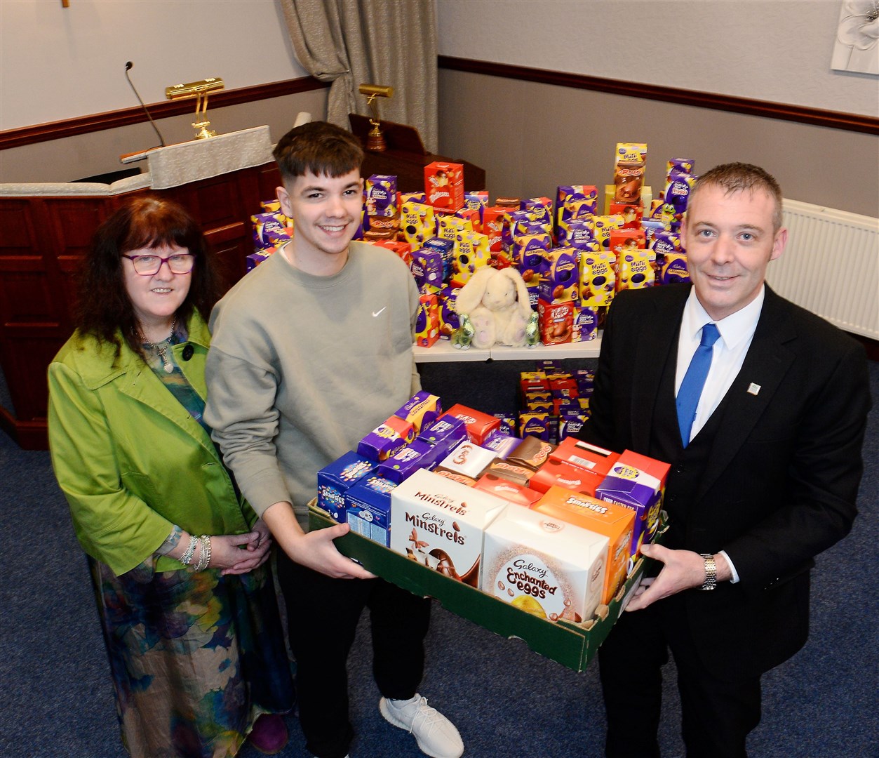 Funeral director Gary Clark (left) with Janette Douglas and Josh Hutchison from The Place Alness and the 195 eggs donated by local businesses. Picture Gary Anthony