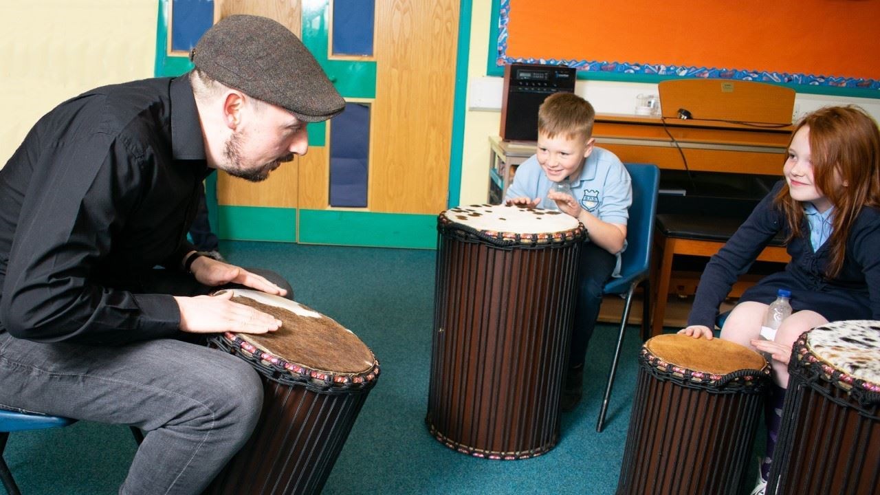 Music tutor Calum McIntyre with some young pupils.