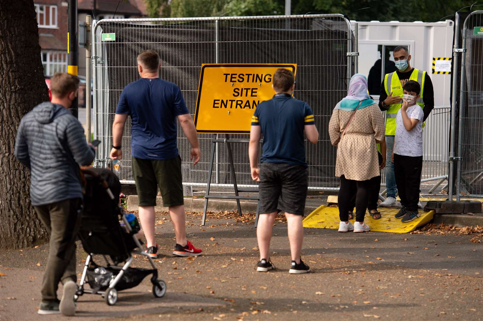Members of the public queue at a coronavirus testing facility in Sutton Coldfield, Birmingham (Jacob King/PA)