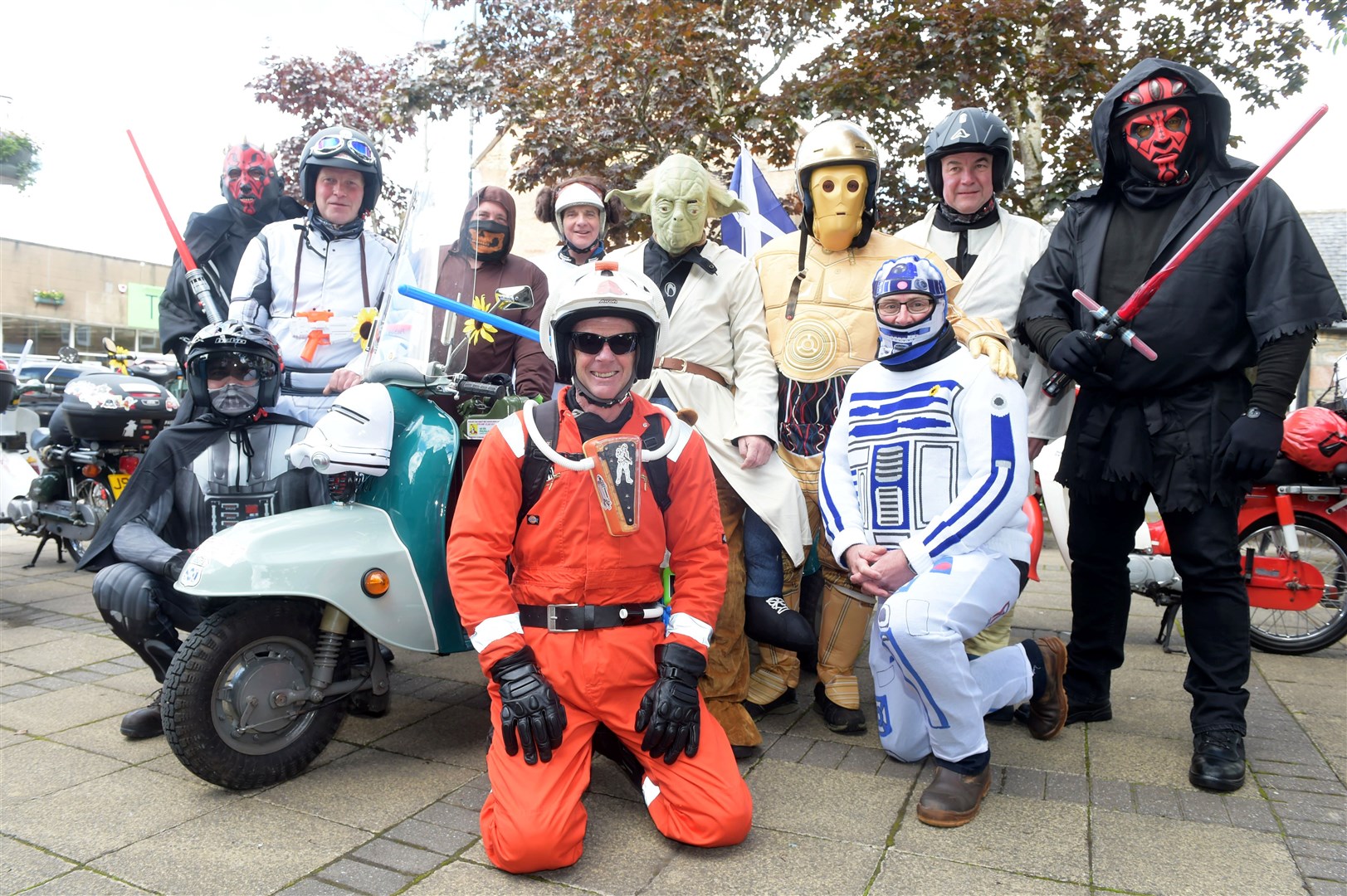 Moped riders from Alness area gather on the High Street dressed as Star Wars characters for a charity fundraising jaunt around the NC500 for Highland Hospice. The total raised this year exceeds £7000. Picture: Callum Mackay. Image No. 044229
