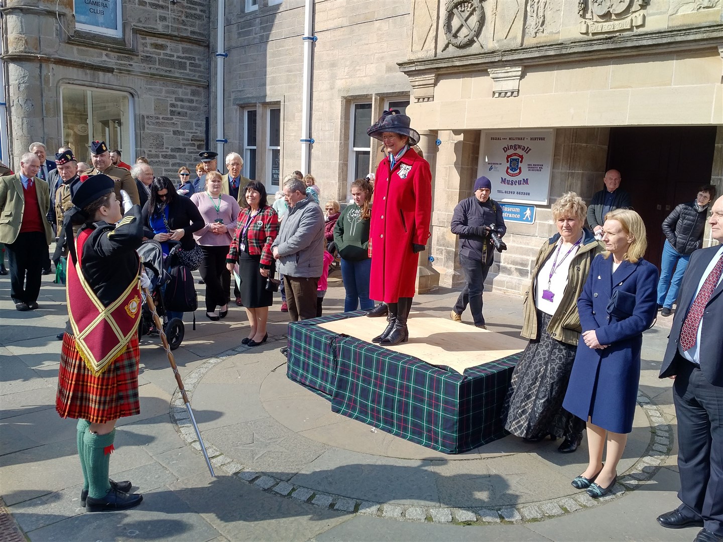Drum Major Jodie Standen asking Lord Lieutenant Mrs Janet Bowen permission to march the Tri Service Cadet Pipes & Drums off parade outside Dingwall Town Hall.