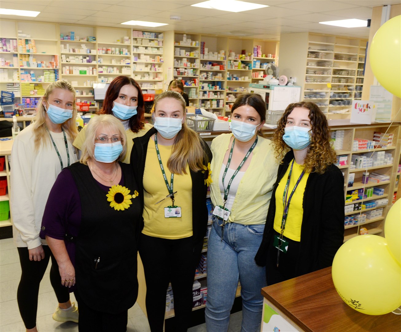 Staff go yellow for Highland Hospice at Lochardil Pharmacy. Picture Gary Anthony