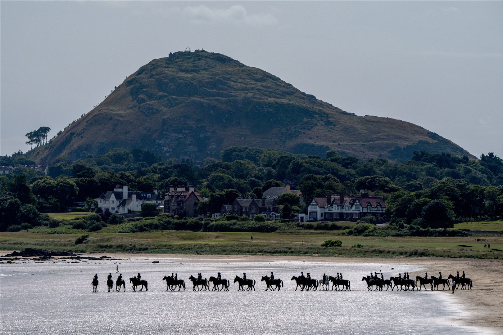 Members of the Blues and Royals exercise their horses at Yellowcraig Beach (Jane Barlow/PA)