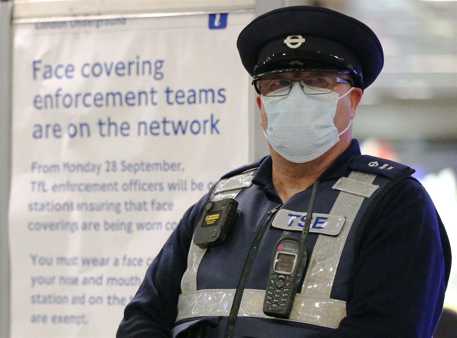 A TfL transport support and enforcement officer at King’s Cross underground station (Jonathan Brady/PA)