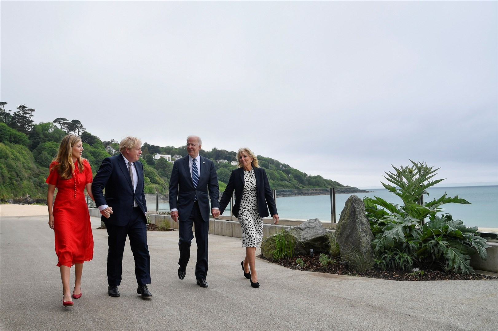 Carrie Johnson, Prime Minister Boris Johnson, US President Joe Biden and first lady Jill Biden walk outside Carbis Bay Hotel (Toby Melville/PA)