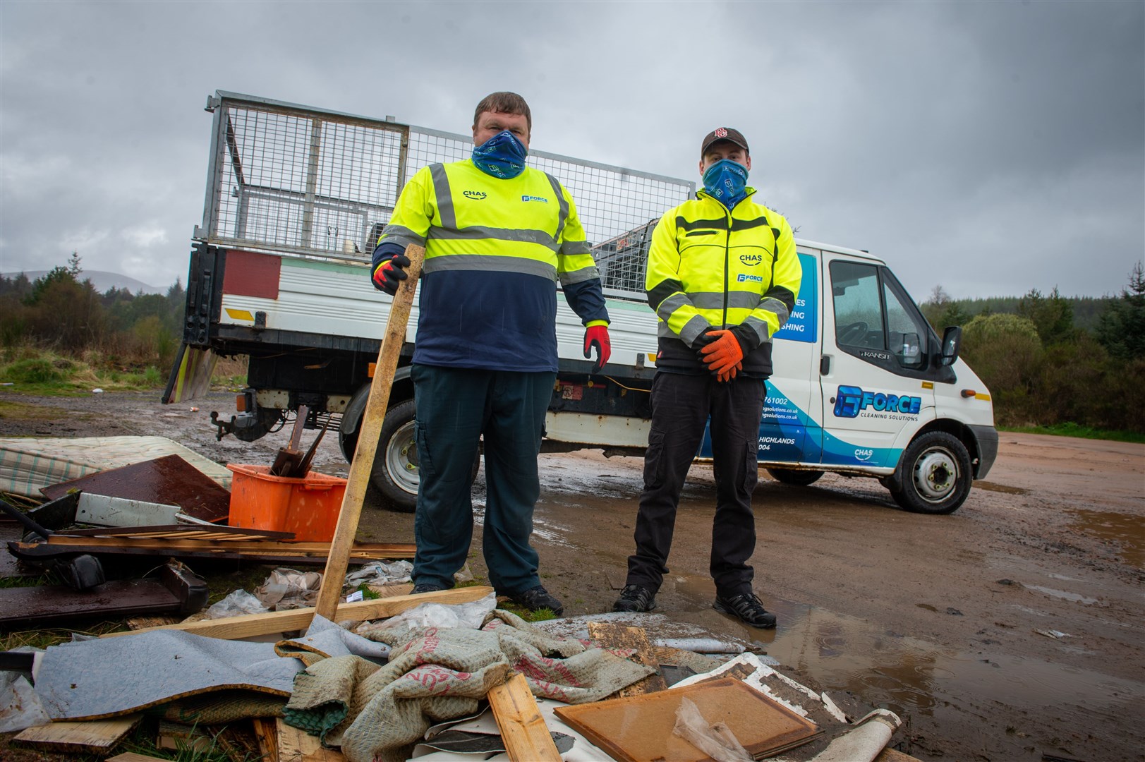 Michael Gliniecki and Liam Urquhart of G-Force removing the rubbish. Picture: Callum Mackay