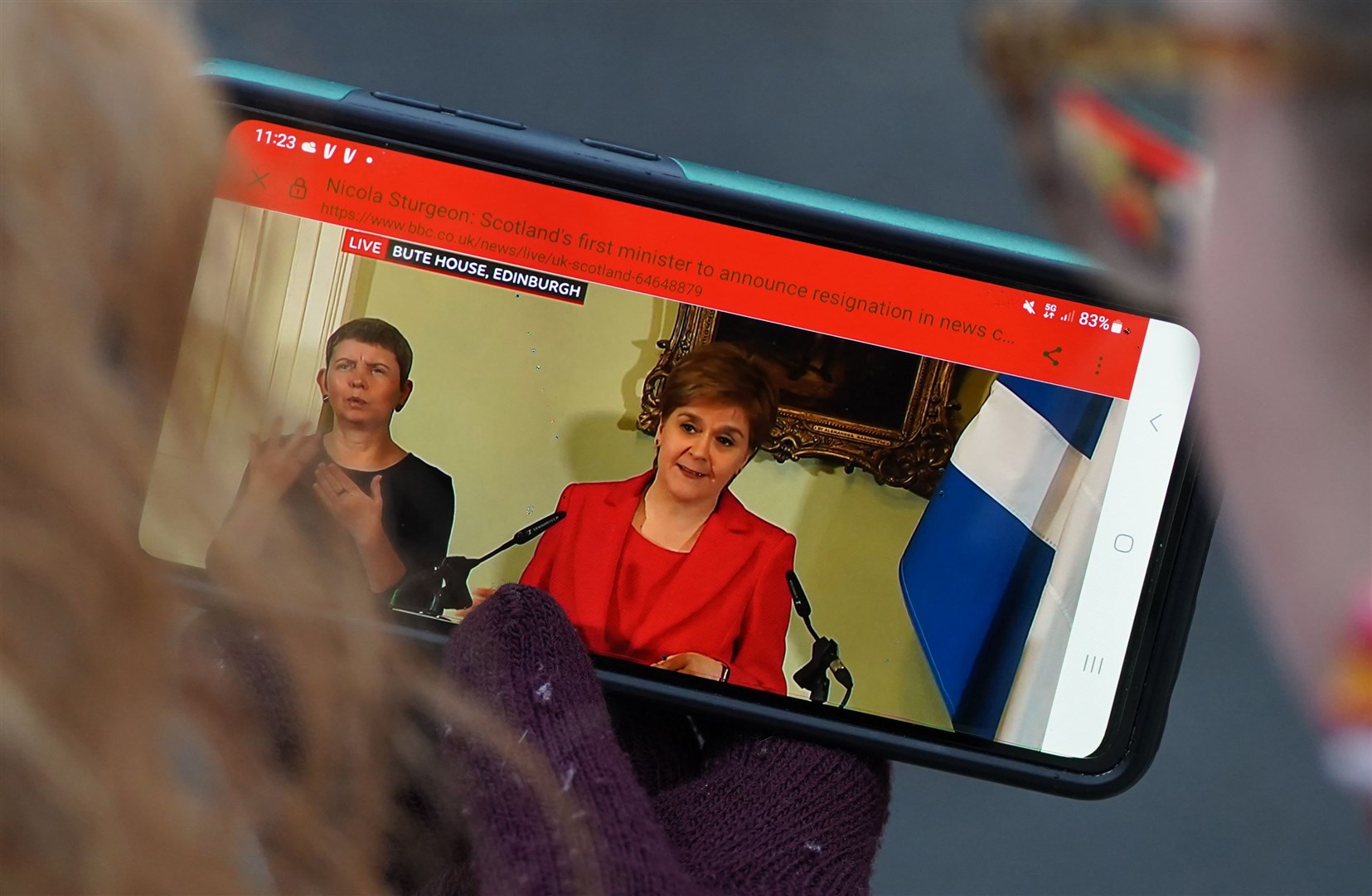 Members of the public outside Bute House in Edinburgh watching the press conference where First Minister Nicola Sturgeon announced she will stand down as First Minister for Scotland (Andrew Milligan/PA)