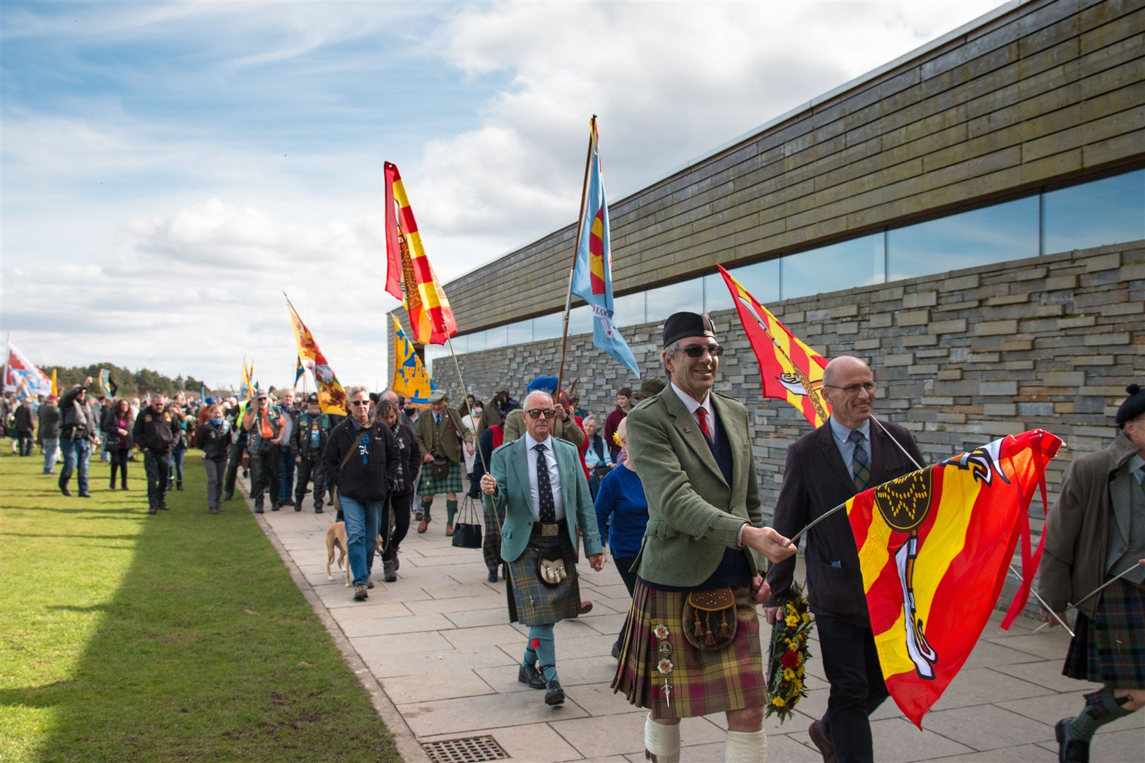 A parade of flags makes its way to Culloden Battlefield.