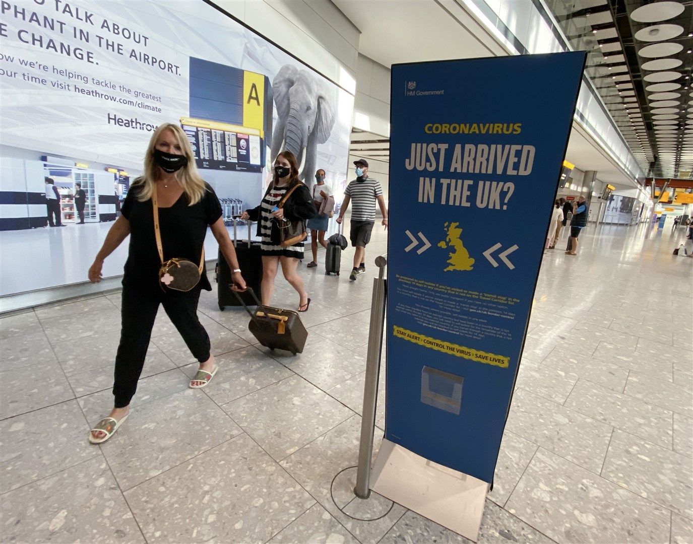 Passengers arrive at Heathrow Airport (Yui Mok/PA)