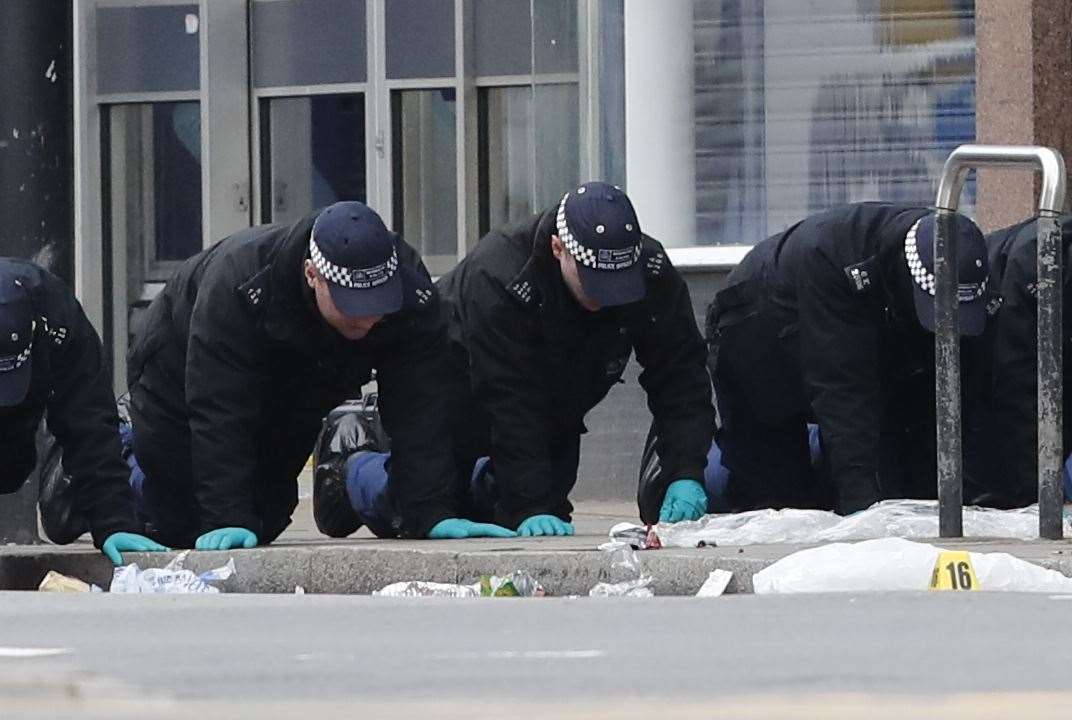 Police conduct a fingertip search following the terror attack in Streatham High Road (Aaron Chown/PA)