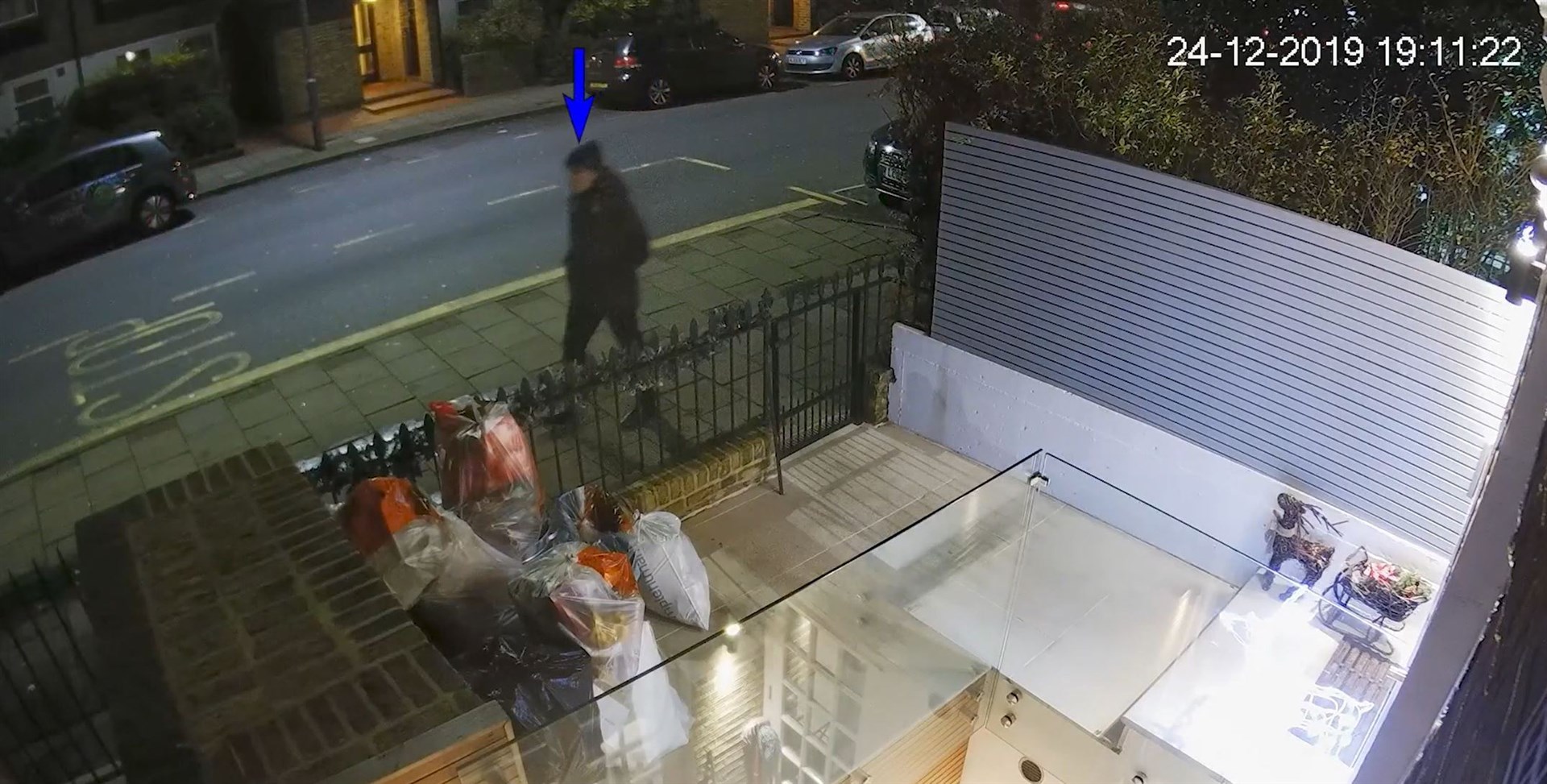 CCTV grab of a man wearing dark clothing outside the home of Flamur Beqiri (Metropolitan Police/PA)
