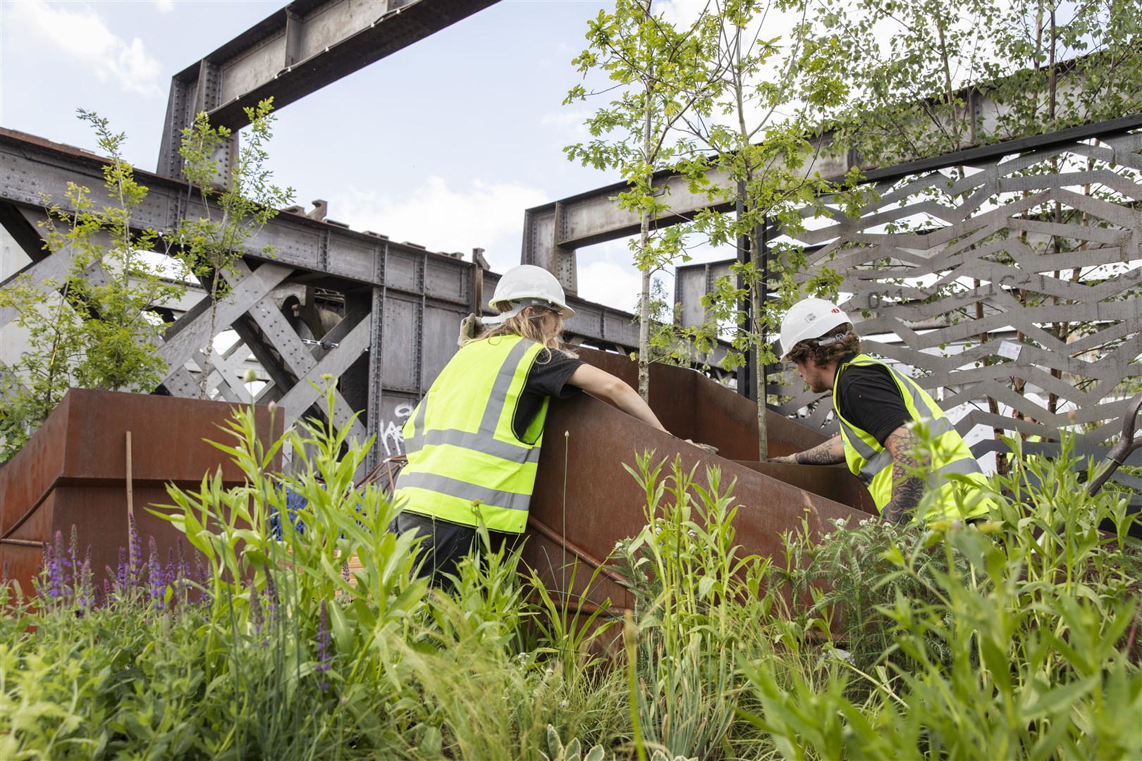National Trust gardeners planting at the Castlefield Viaduct in Manchester (Annapurna Mellor/National Trust/PA)