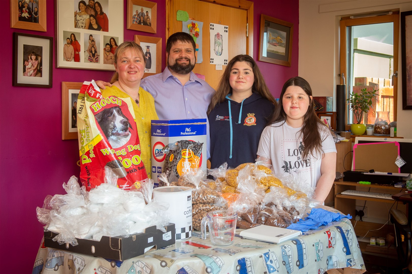 The Food Share Point in Dingwall has been crowdfunding to raise extra cash to buy more to help those hit hard during the lockdown. Fiona Harrison, Andrew Smith, Regan Smith and Darcie Smith sort out some of the items. Picture: Callum Mackay