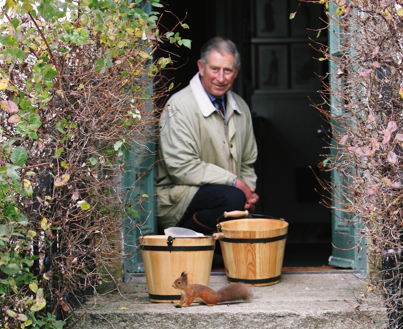 Charles with a red squirrel at Birkhall in 2008 (Sue Crawford/Clarence House/PA)
