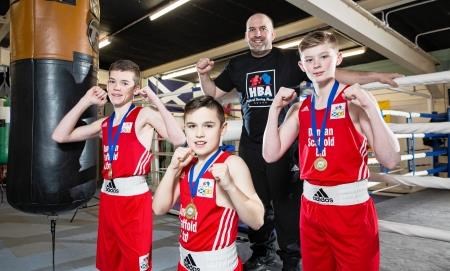 Coach Liam Foy with young boxers (left to right) Lewis Urquhart from Dingwall, Ewan Gliniecki from Alness and Nairn youngster, also named Lewis Urquhart