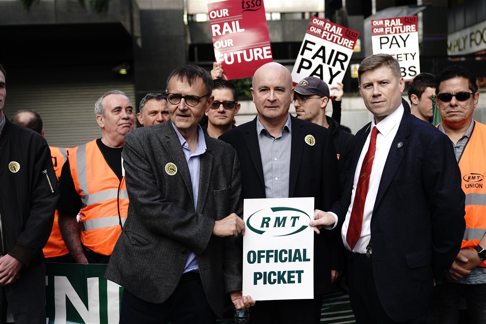 RMT general secretary Mick Lynch (centre) and assistant general secretary Eddie Dempsey with striking workers outside London Euston (Aaron Chown/PA)
