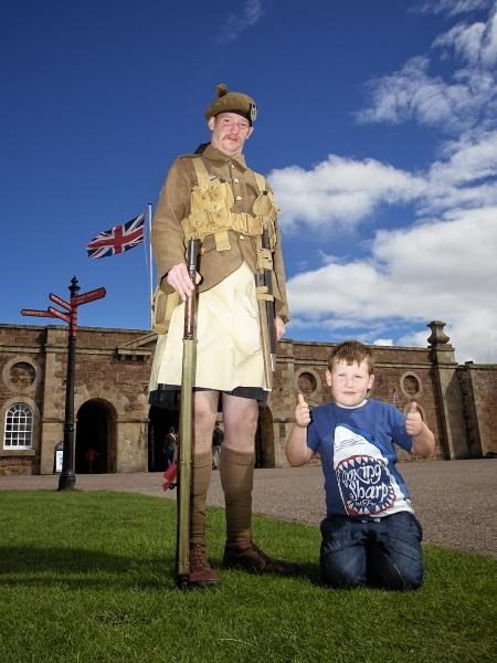 A member of re-enactment group The Gordon Highlanders 1914-18, who are taking part in the Tattoo, along with young Tattoo fan Rory Fotheringham (6) from Inverness.