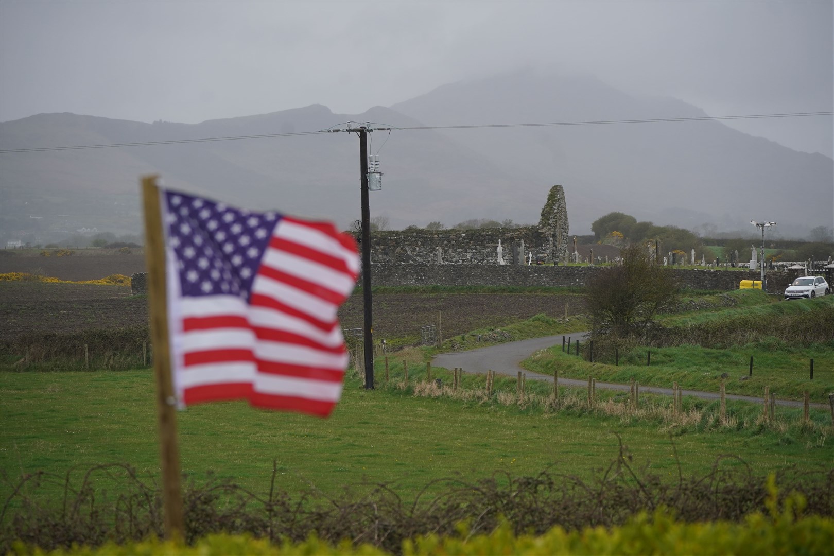 A Stars and Stripes flag flies close to Kilwirra cemetery and church ruins, where the relatives of US President Joe Biden are buried, near Carlingford in Co Louth (Niall Carson/PA)