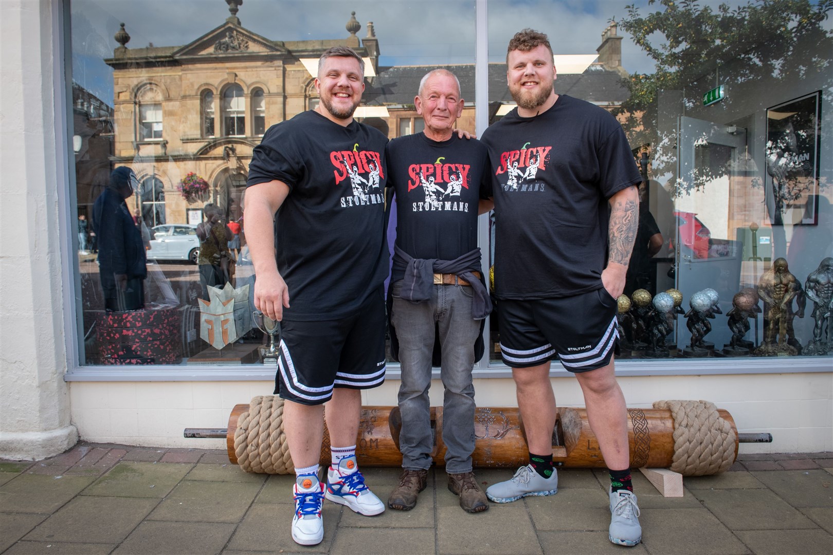 Luke and Tom Stoltman with dad Ben Stoltman. Picture: Callum Mackay..