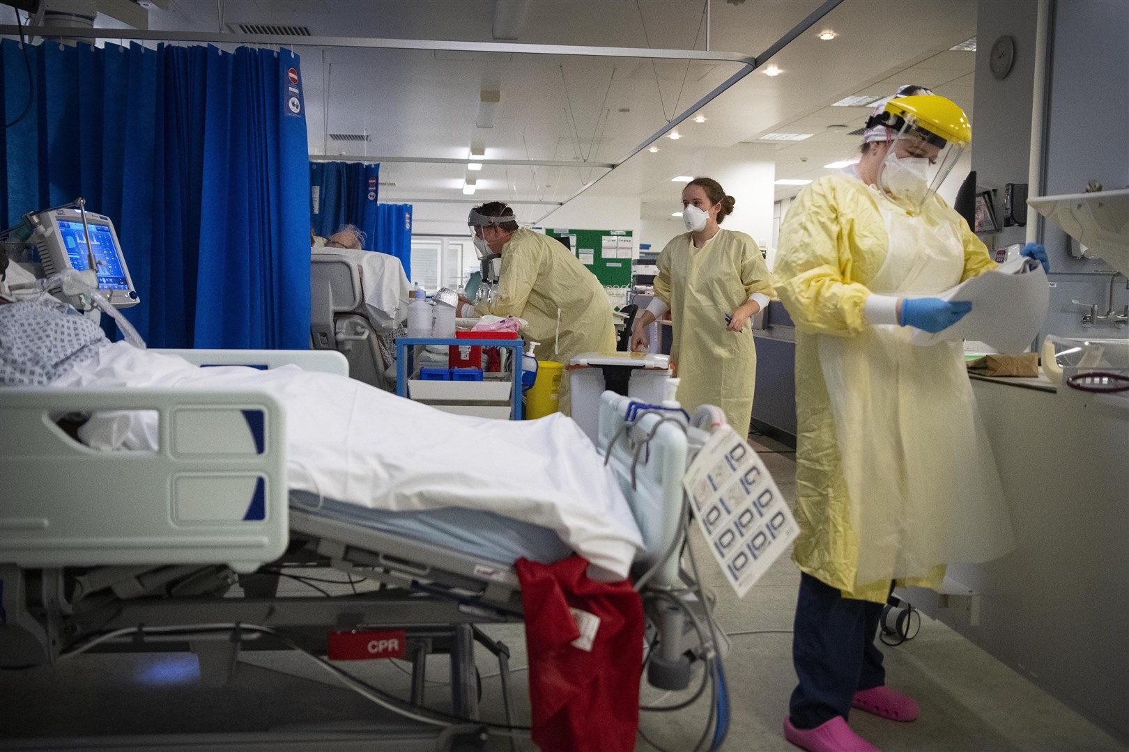 Nurses work on patients in an intensive care unit during the coronavirus pandemic (Victoria Jones/PA) 