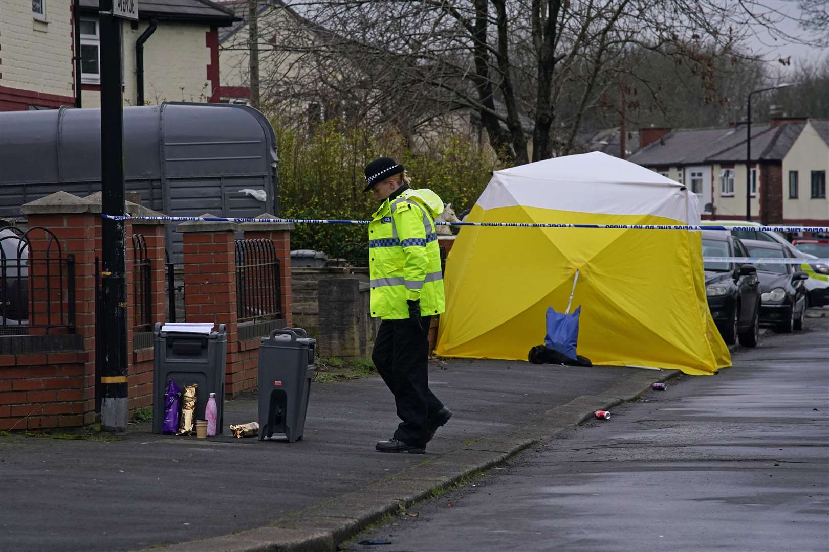 Police at the scene after a 16-year-old boy was fatally stabbed in Stretford, Manchester (Peter Byrne/PA)