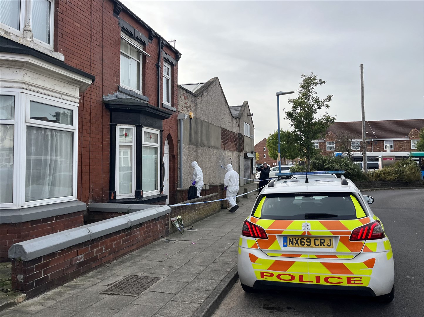 Forensics officers enter a cordoned-off property in Wharton Terrace, Hartlepool (Tom Wilkinson/PA)