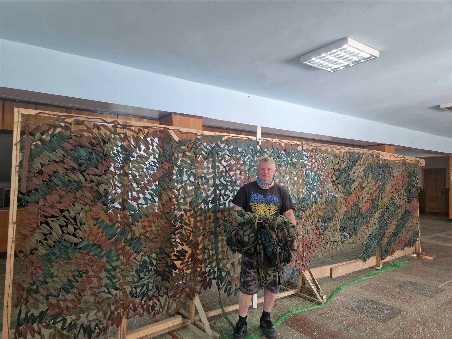 Daniel helped make camouflage netting for Ukrainian vehicles during the trip.