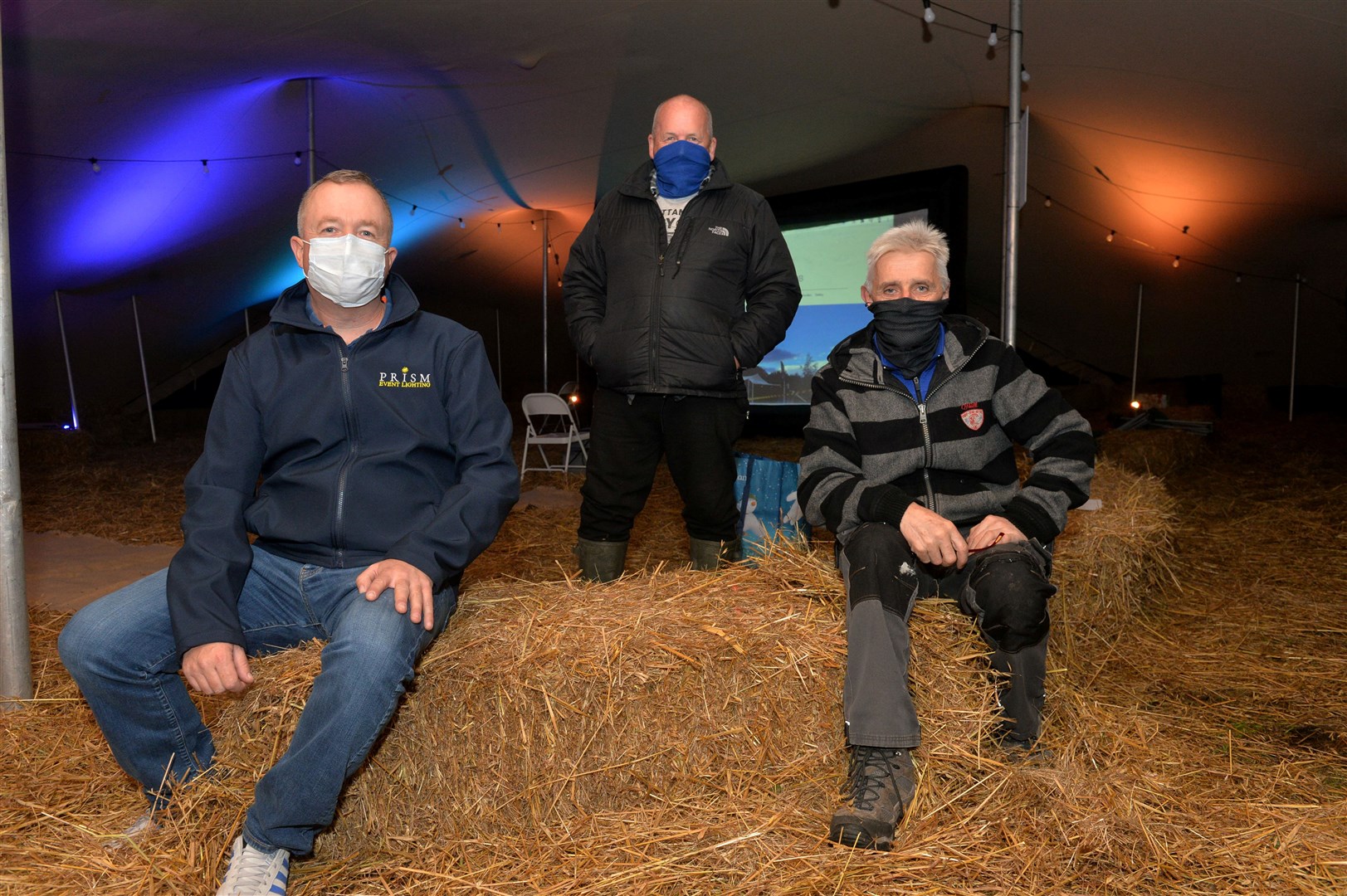 The Field movie night with Keith Bauer from Prism lighting, volunteer Gordon Robertson and John Douglas. Picture: Callum Mackay