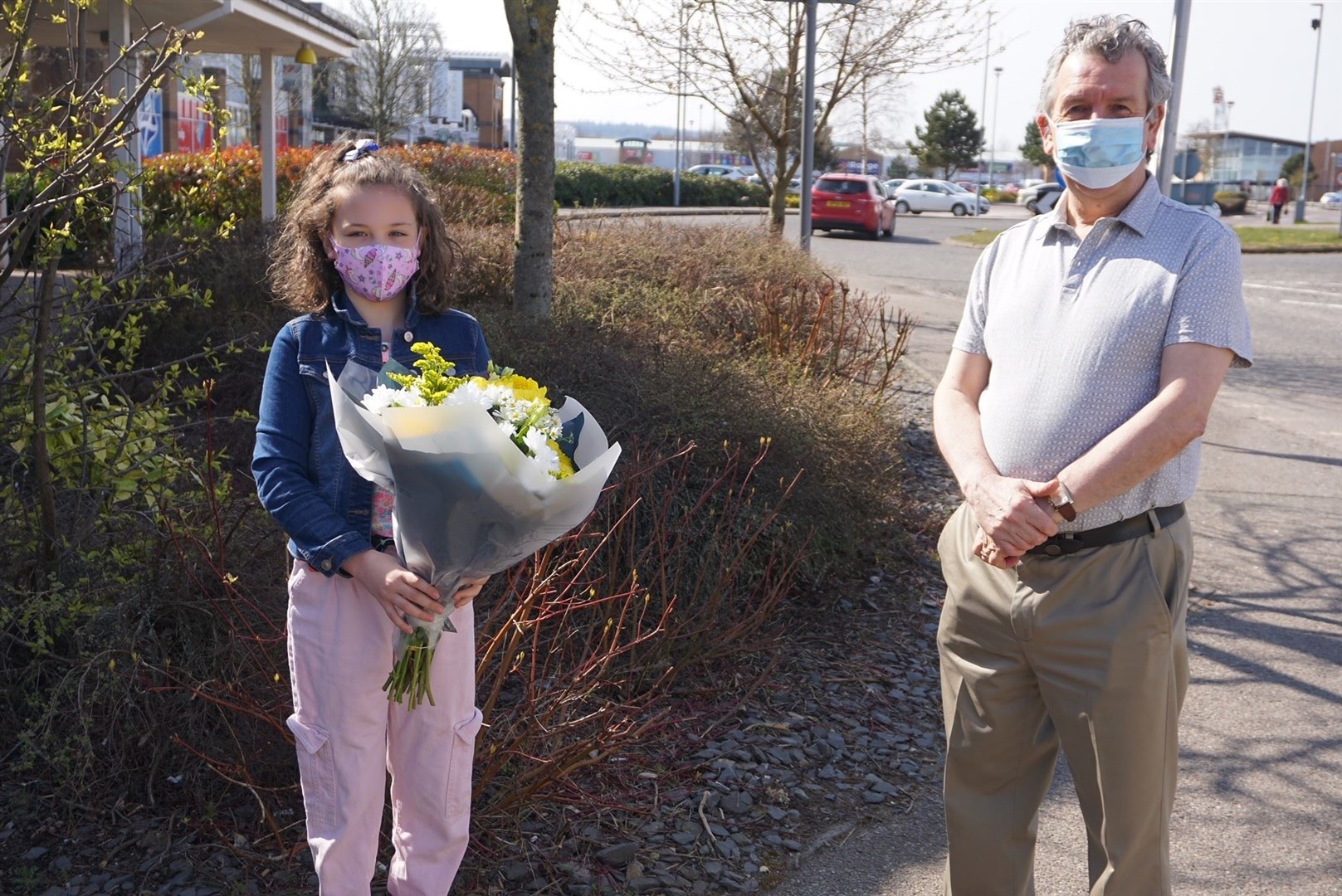 Former MSP David Stewart presented Chloe MacAllister with flowers as thanks for her efforts to educate others about her condition.